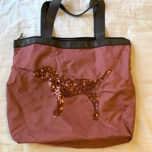 Victoria’s Secret pink travel bag. Small stain on back. $5